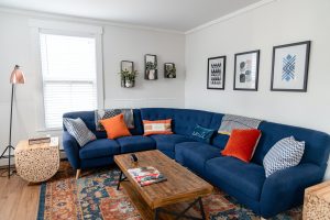 blue couch with area rug