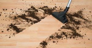 vacuuming dirt on hardwood floor